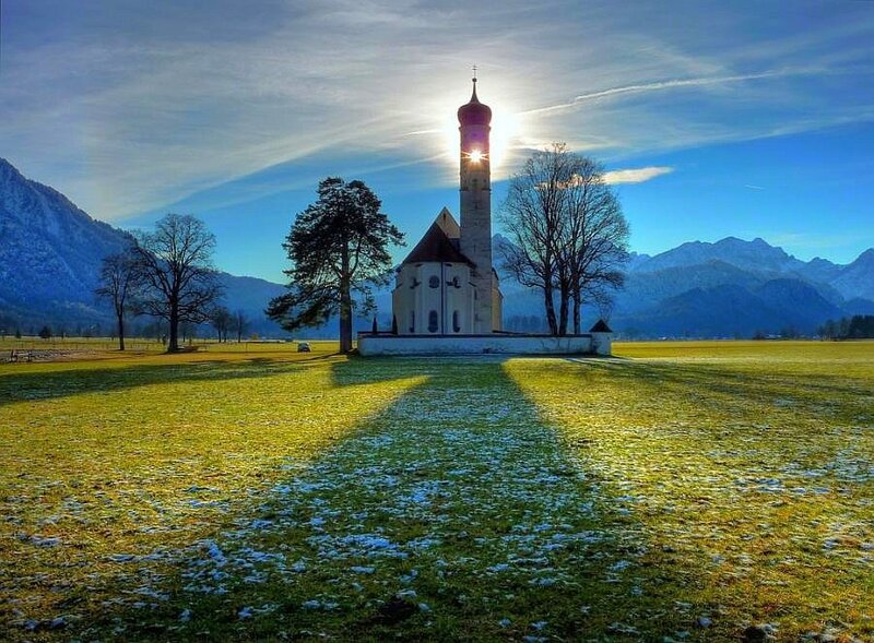 Church at sunrise in a mountain valley