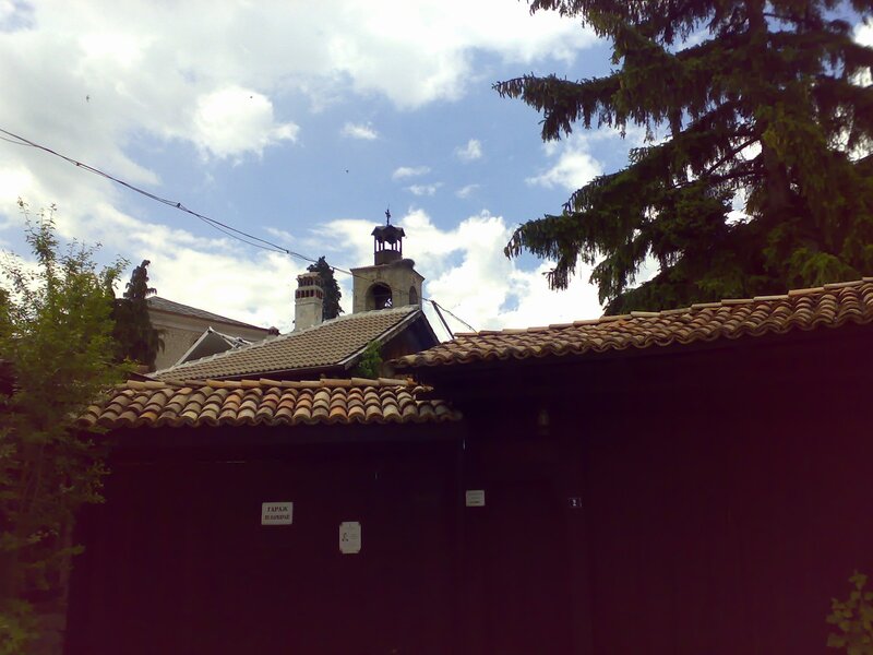 Church bell tower and tiled roofs