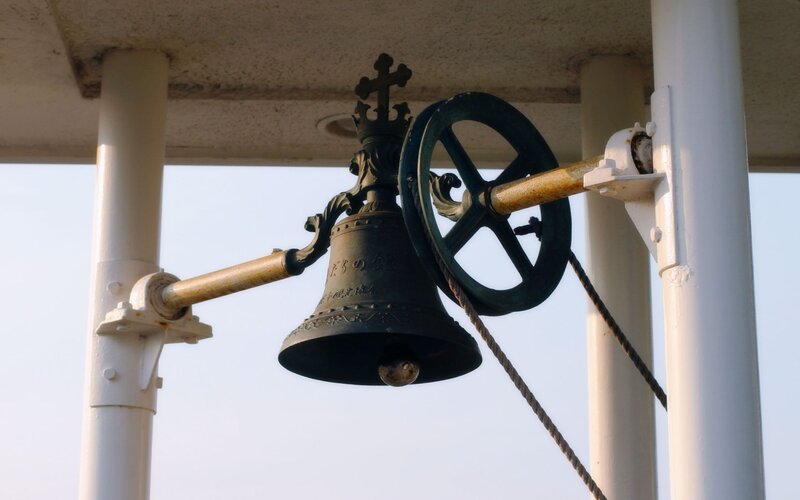 Church bell with rope mechanism