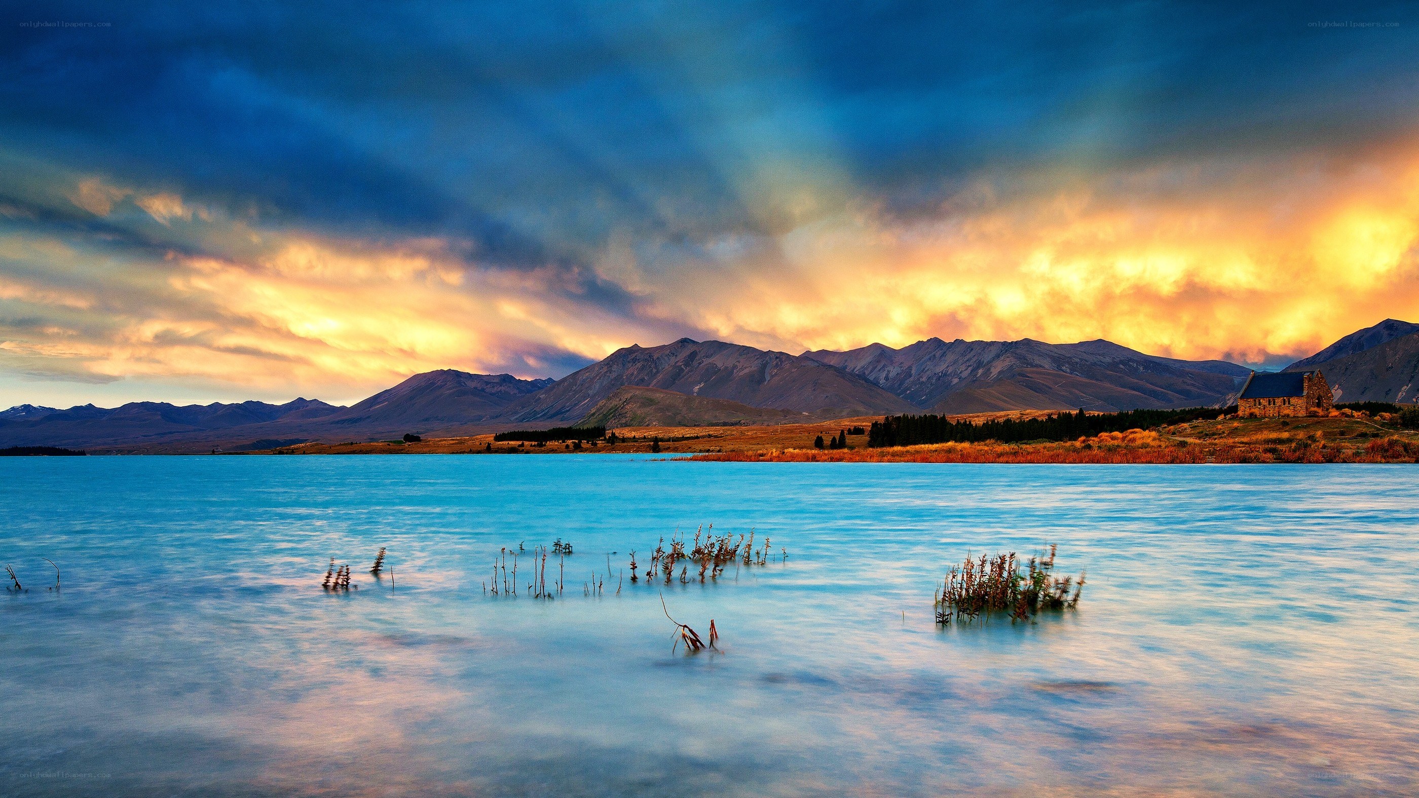 Church by a lake at sunset