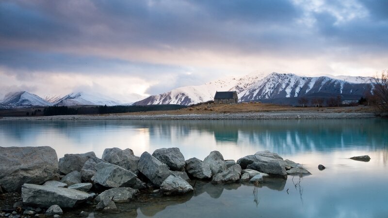 Church by a lake with mountains
