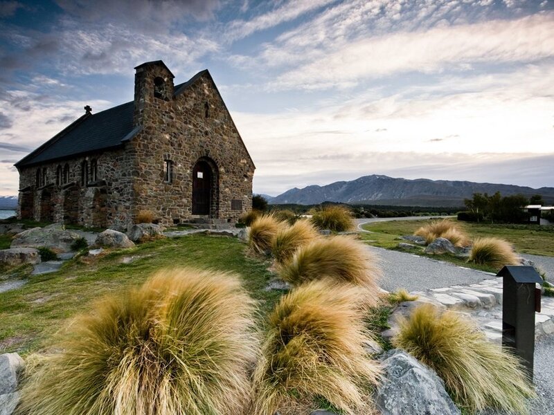 Church by a lake with mountains