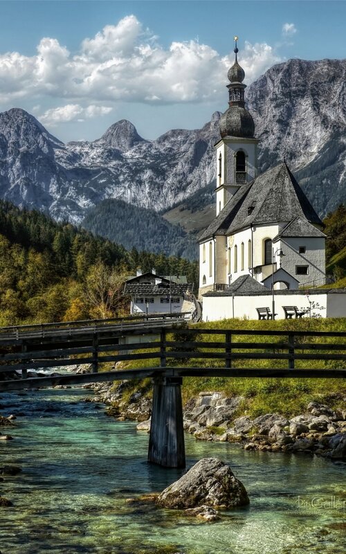 Church by a river in the mountains