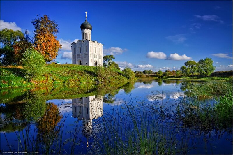 Church by the lake in autumn