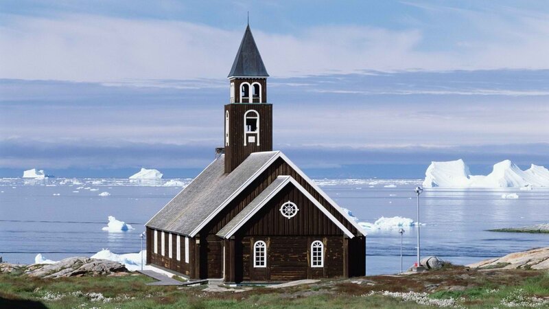 Church by the sea with icebergs