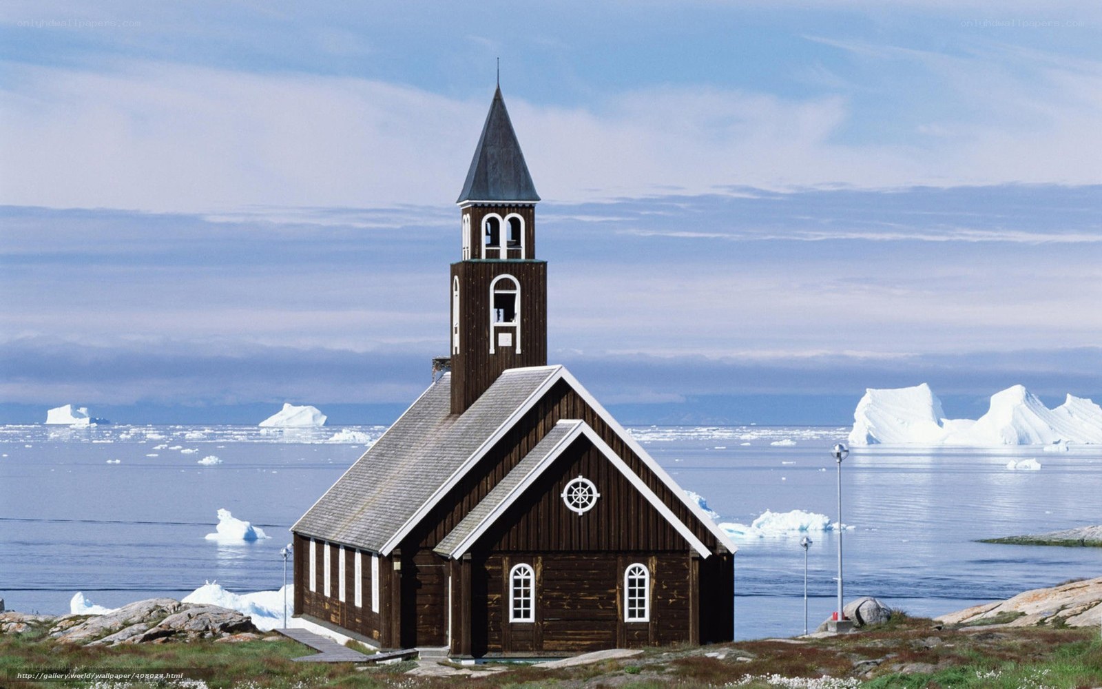 Church by the sea with icebergs