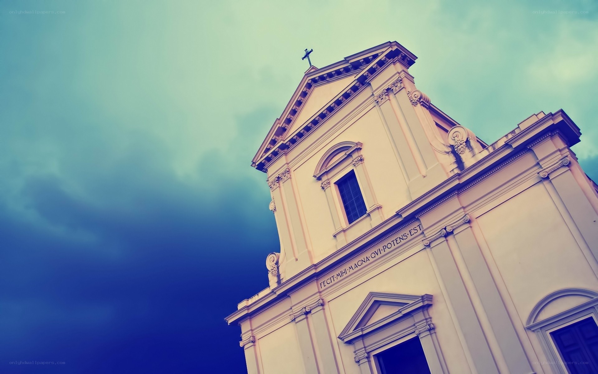Church facade against cloudy sky