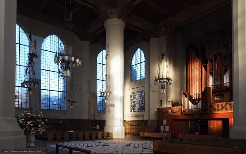 Church interior with organ and stained glass
