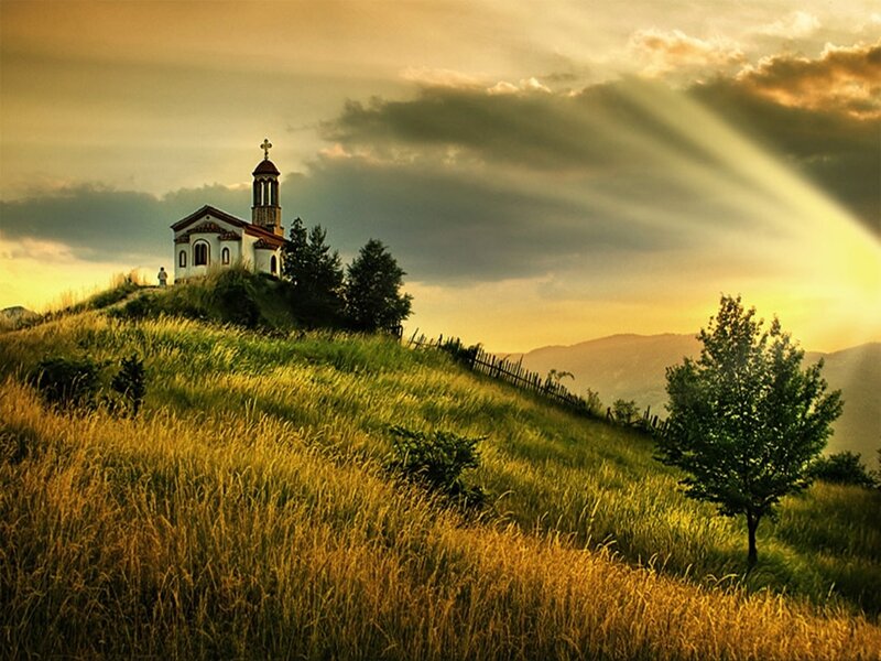 Church on a hill at sunset