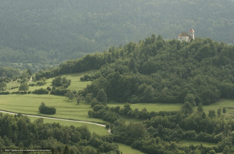 Church on a hill in a green valley