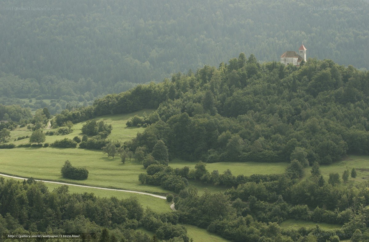 Church on a hill in a green valley