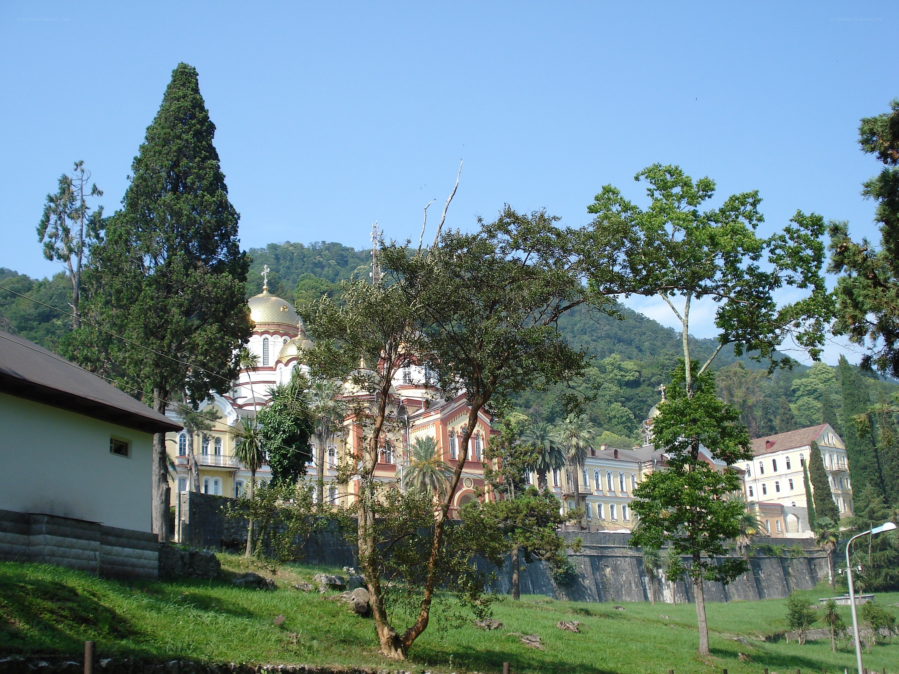 Church on a hillside with trees