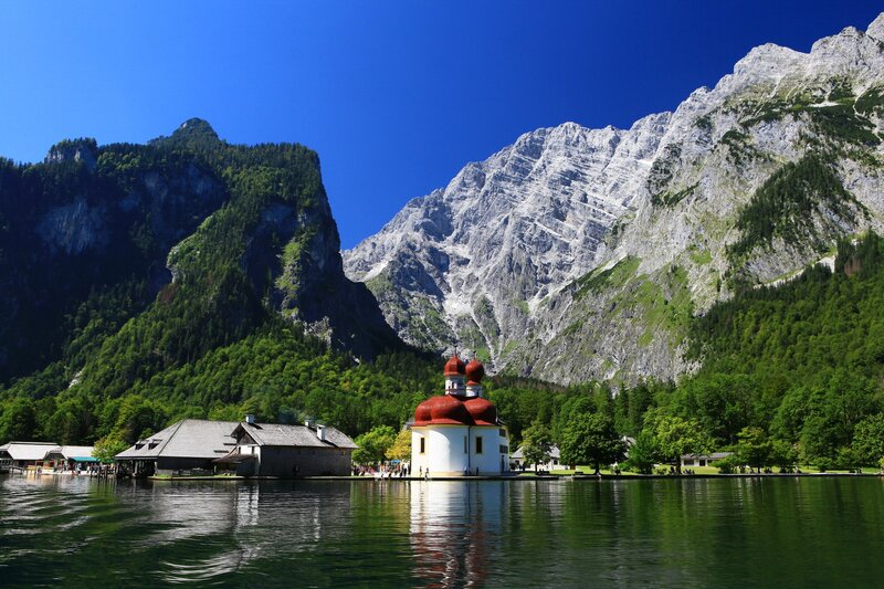Church on a lake in the Alps
