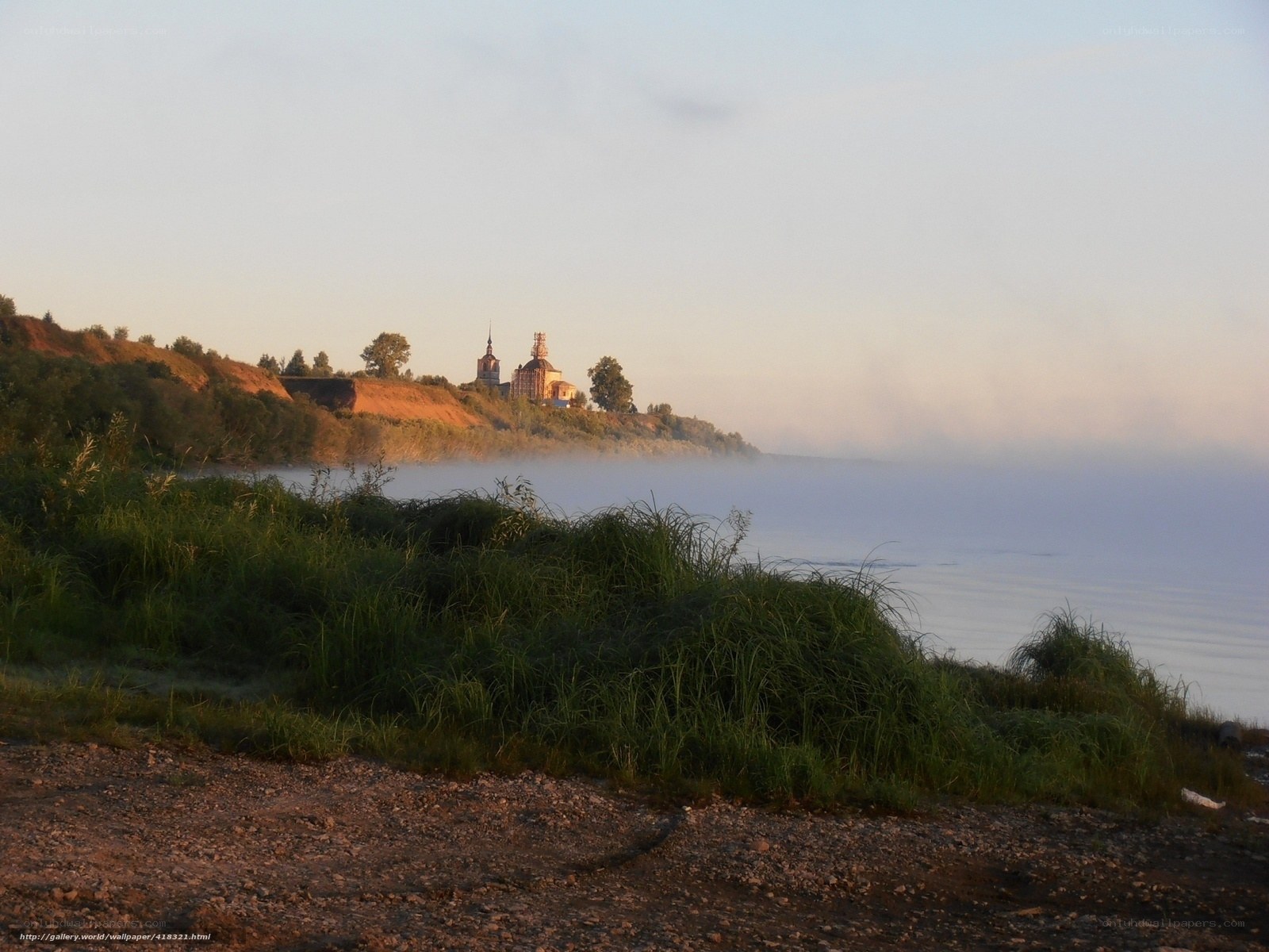 Church on a misty riverbank