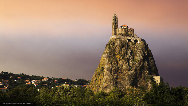 Church on a rocky hill at sunset