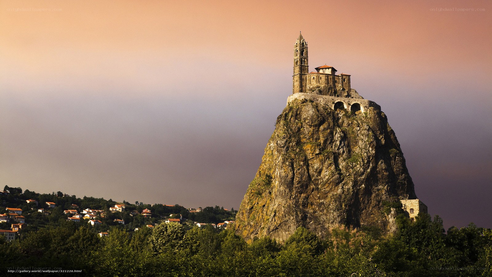 Church on a rocky hill at sunset