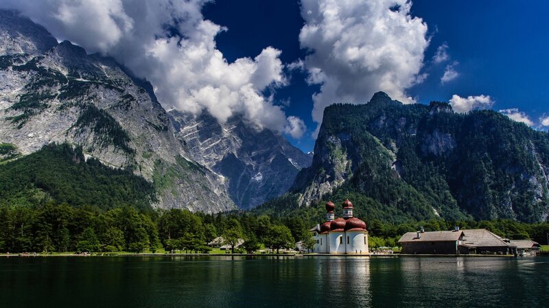 Church on Lake Island — Blue, Serene, Afternoon, Photograph, Mountains, Trees, Clouds