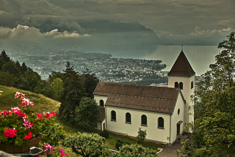 Church overlooking a lake and city