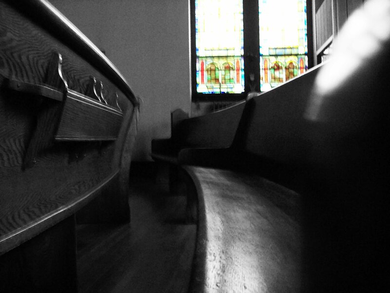 Church pews and stained glass