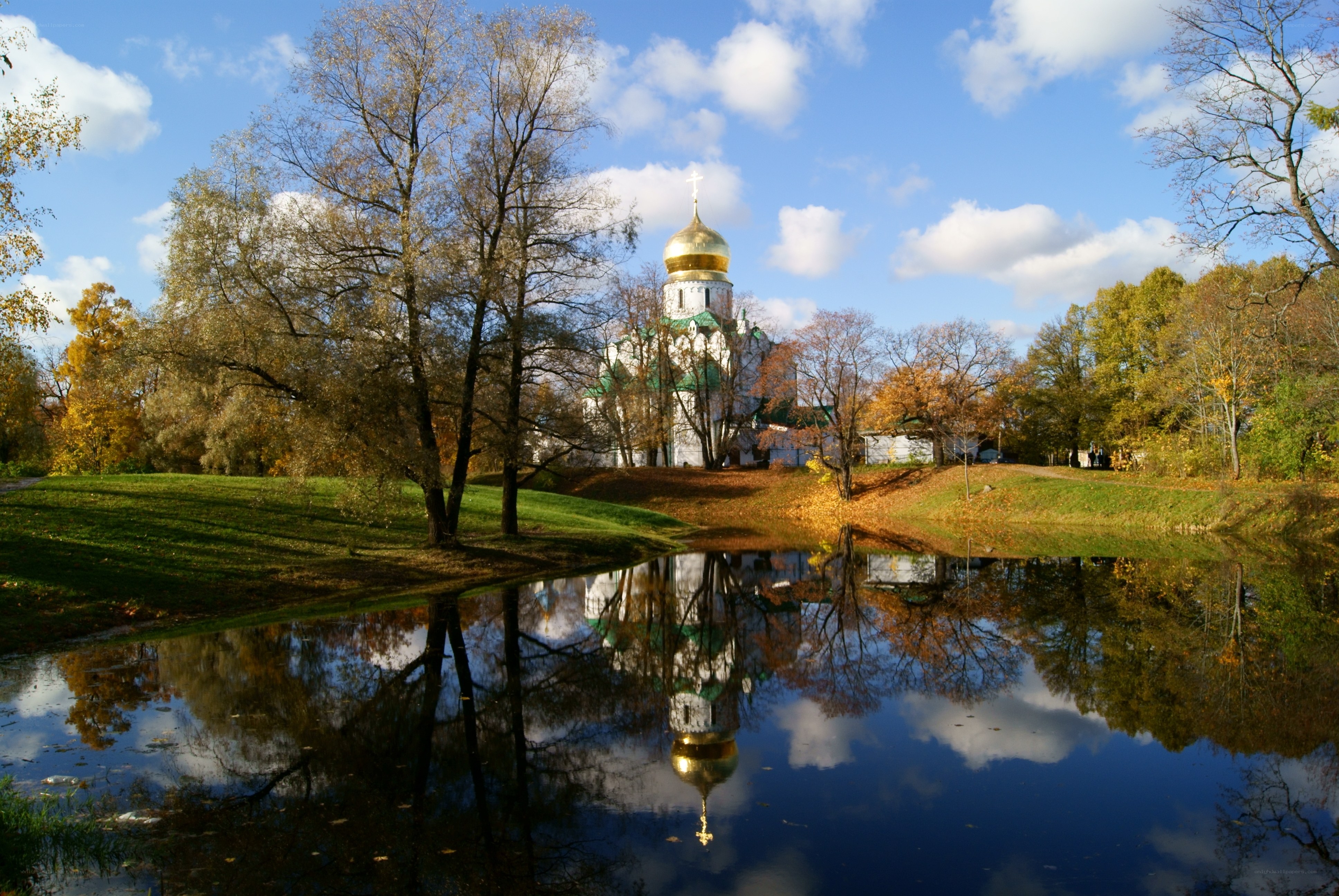 Church reflected in autumn pond