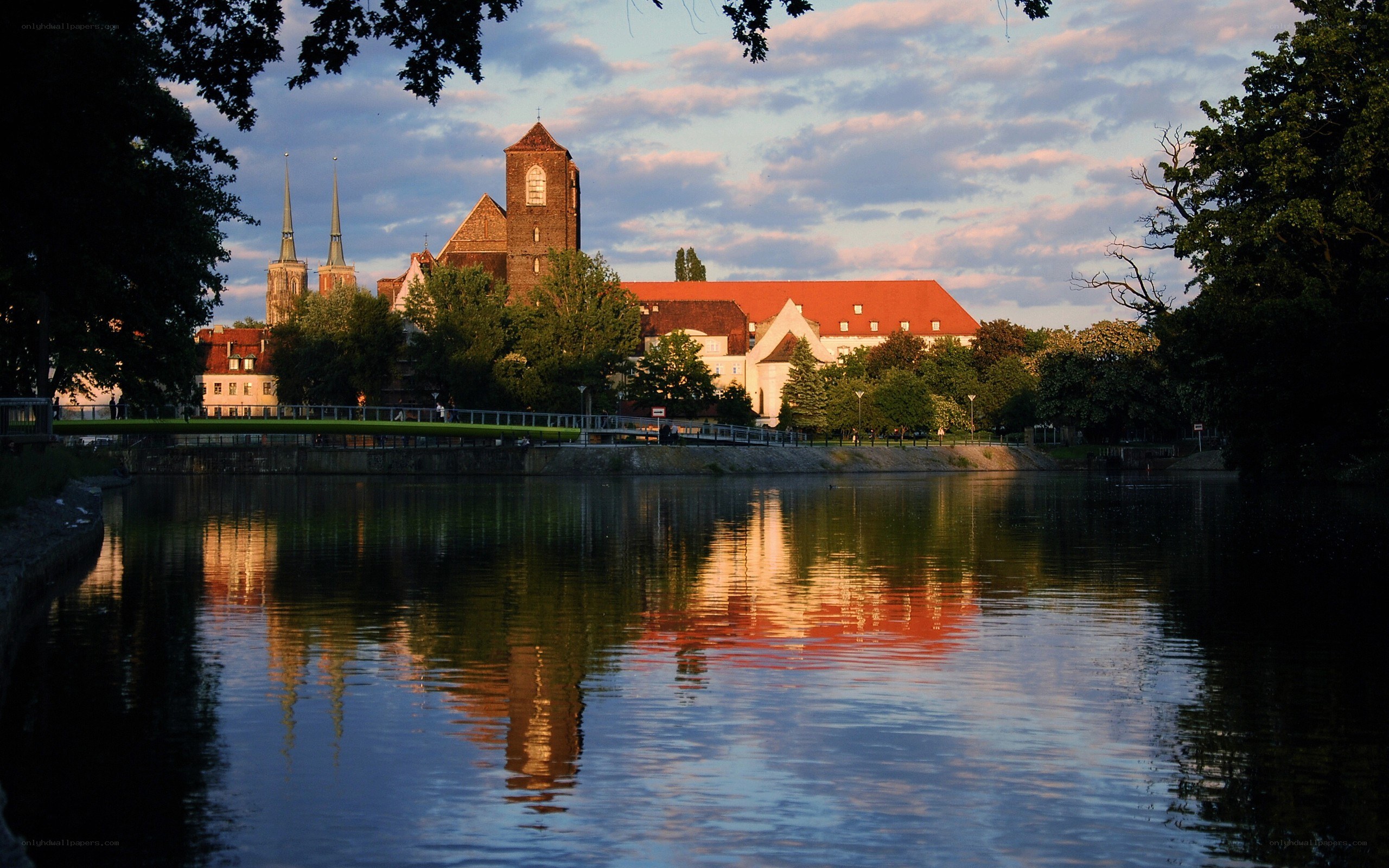 Church reflected in river at dusk
