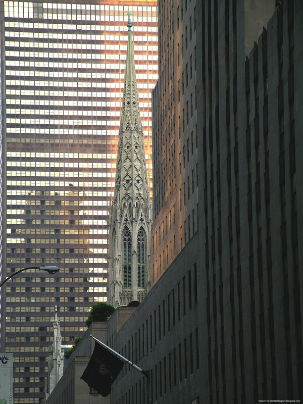 Church spire between skyscrapers