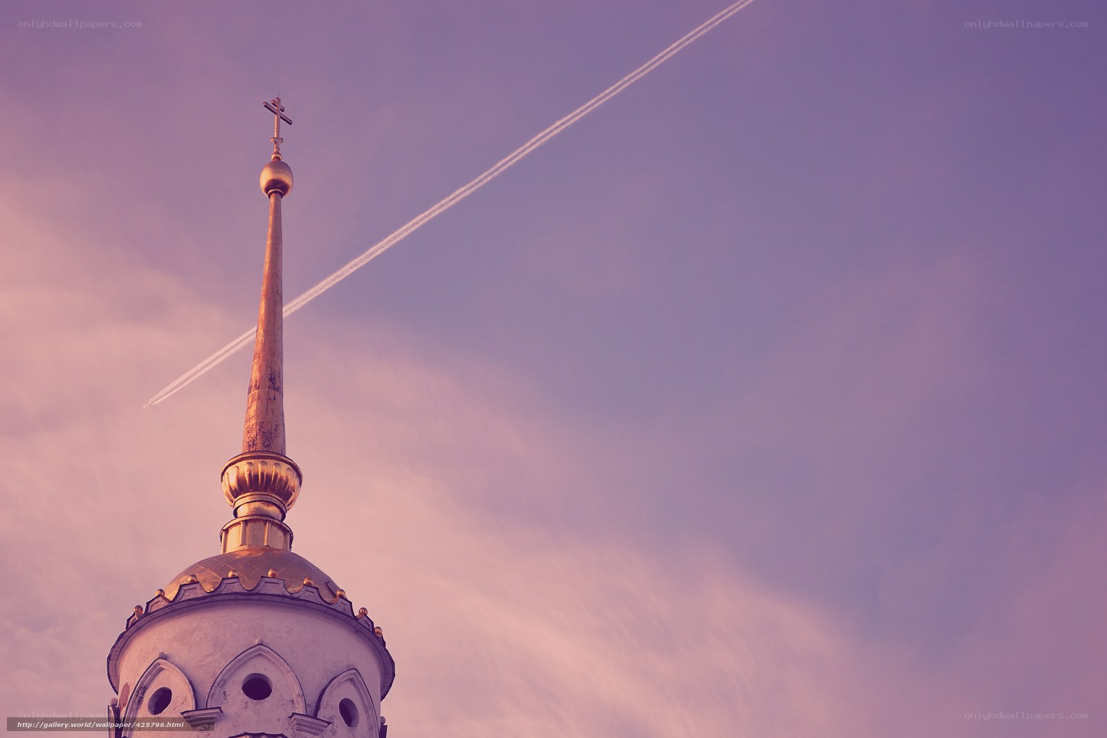 Church spire with contrail