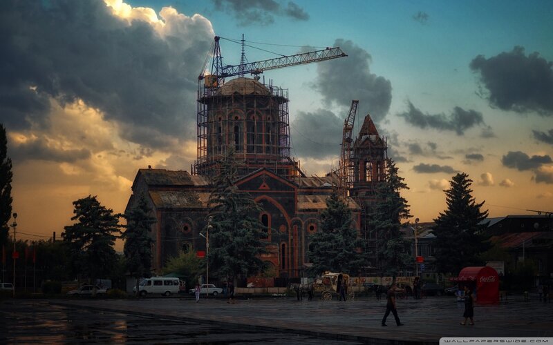Church under construction at sunset