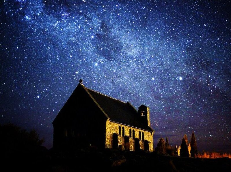 Church under starry night sky