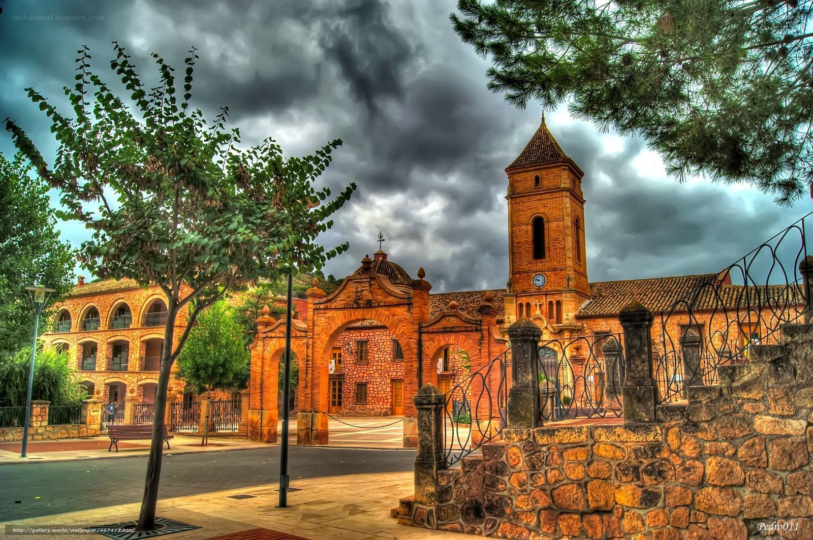 Church with bell tower under stormy sky