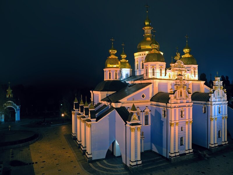 Church with golden domes at night