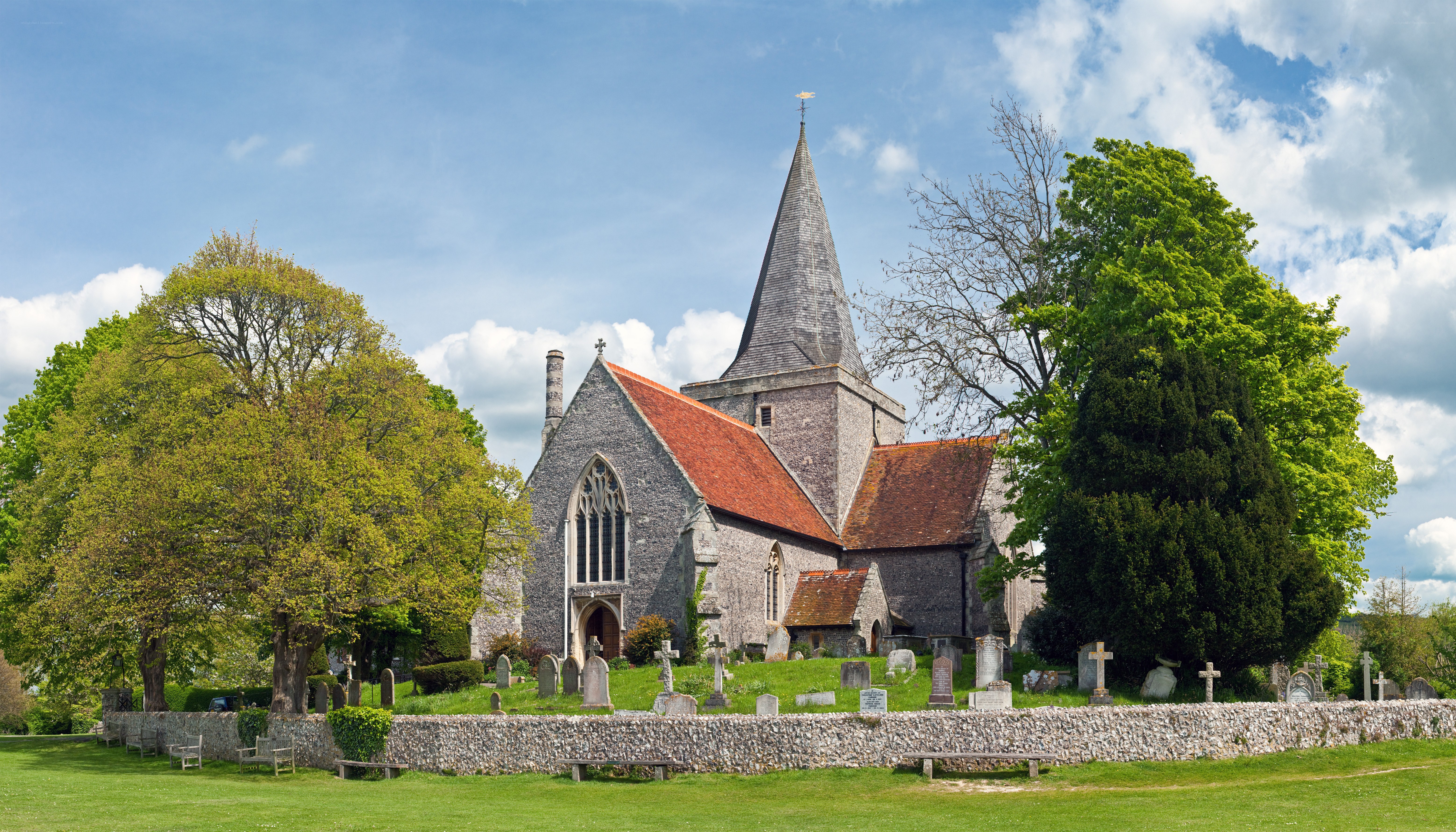 Church with graveyard and trees