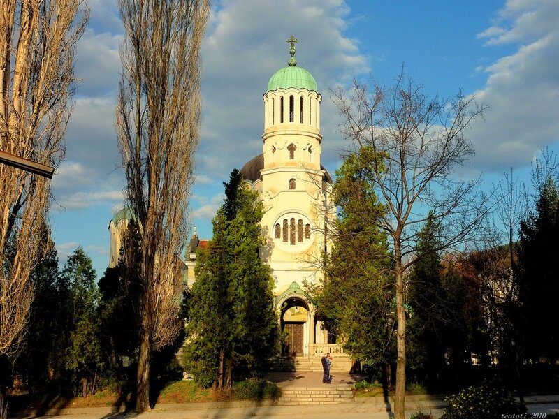 Church with green dome in park