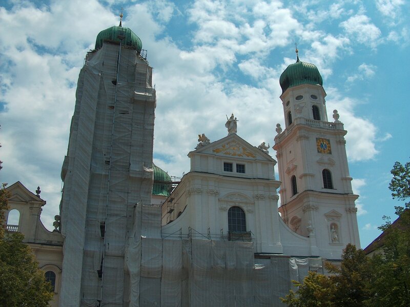 Church with green domes under repair