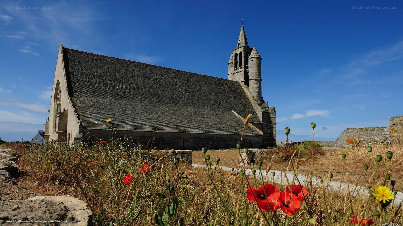 Church with poppies in foreground