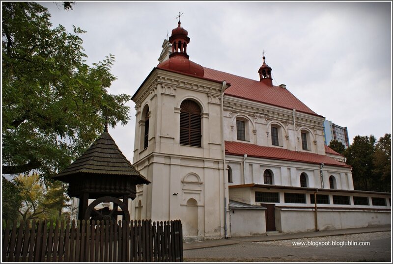Church with red roof and wooden bell tower