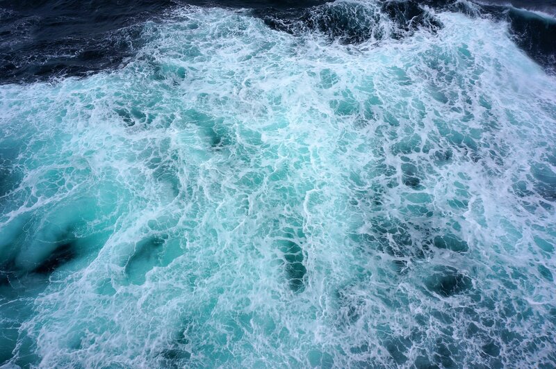 Churning ocean waves from above