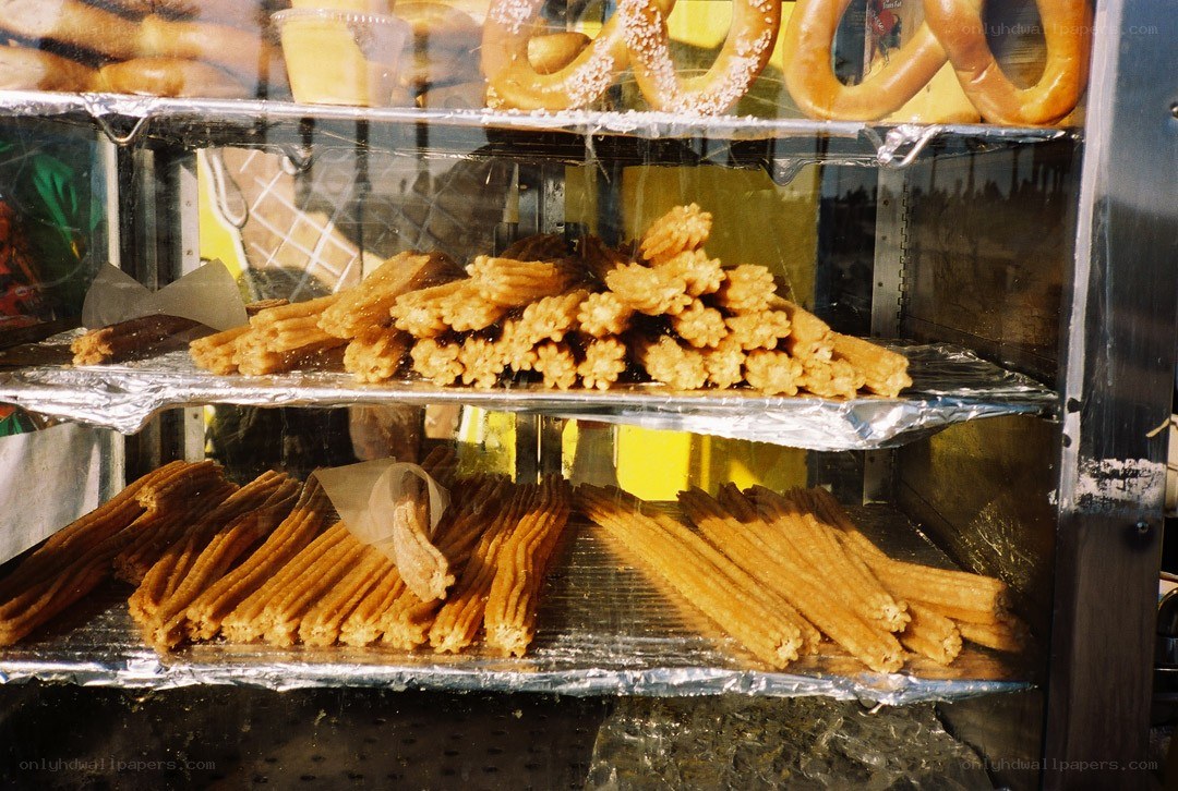 Churros and pretzels in display case