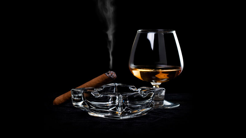 Cigar and brandy on black
