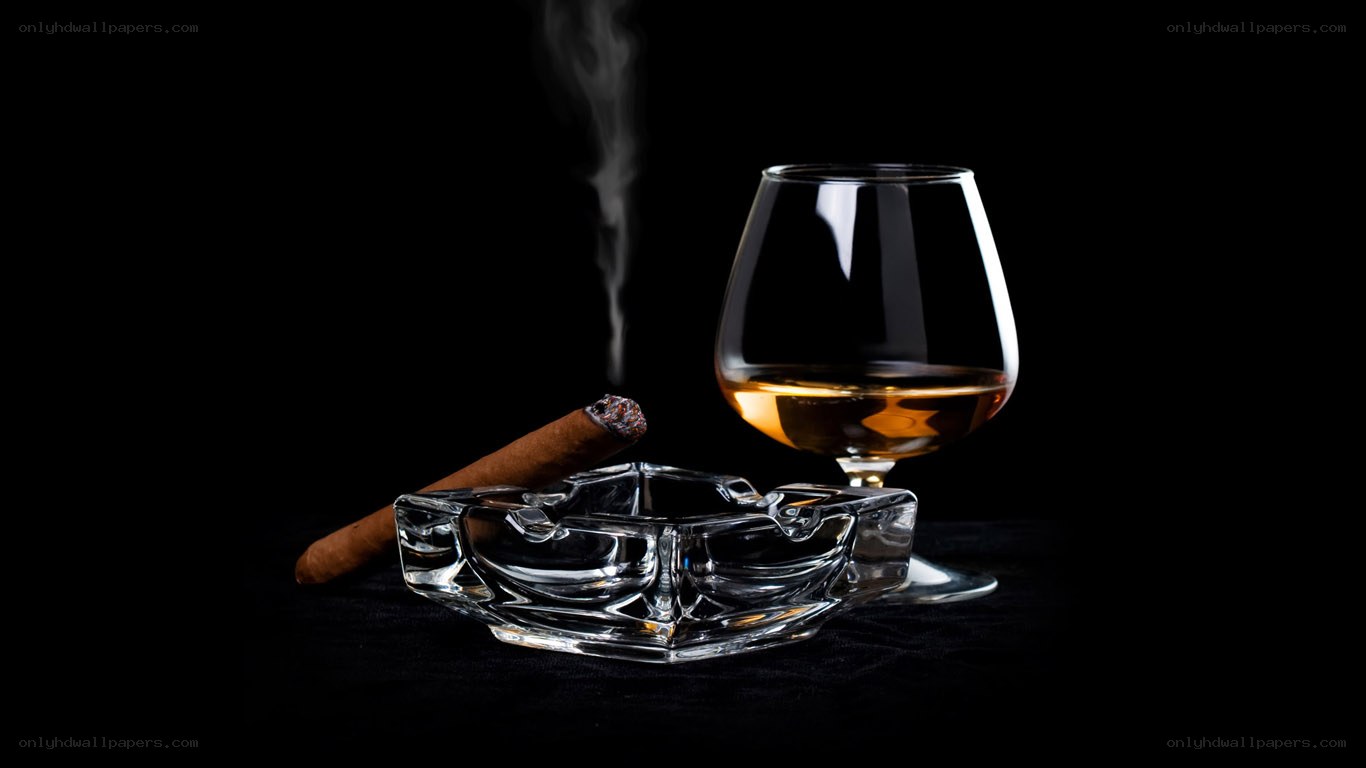 Cigar and brandy on black