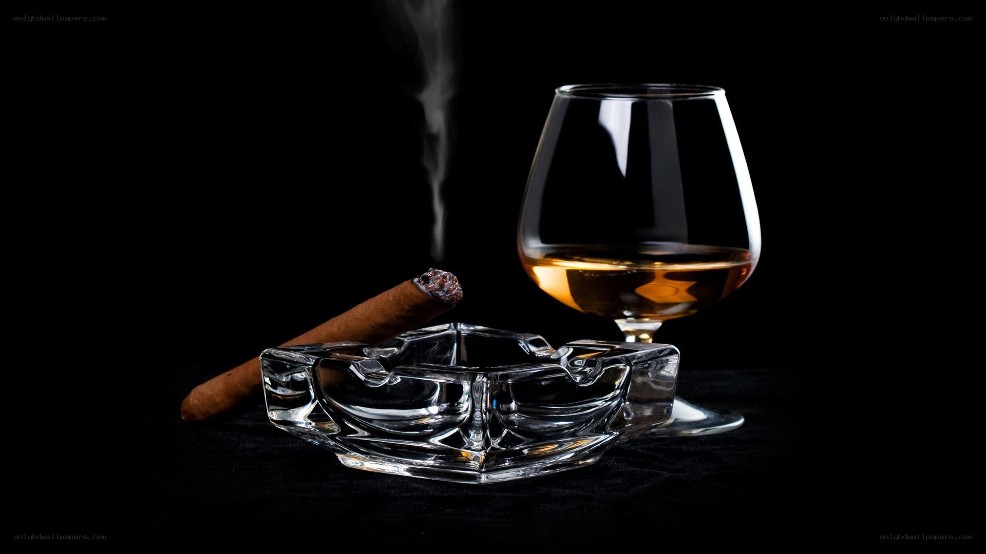 Cigar and brandy on black