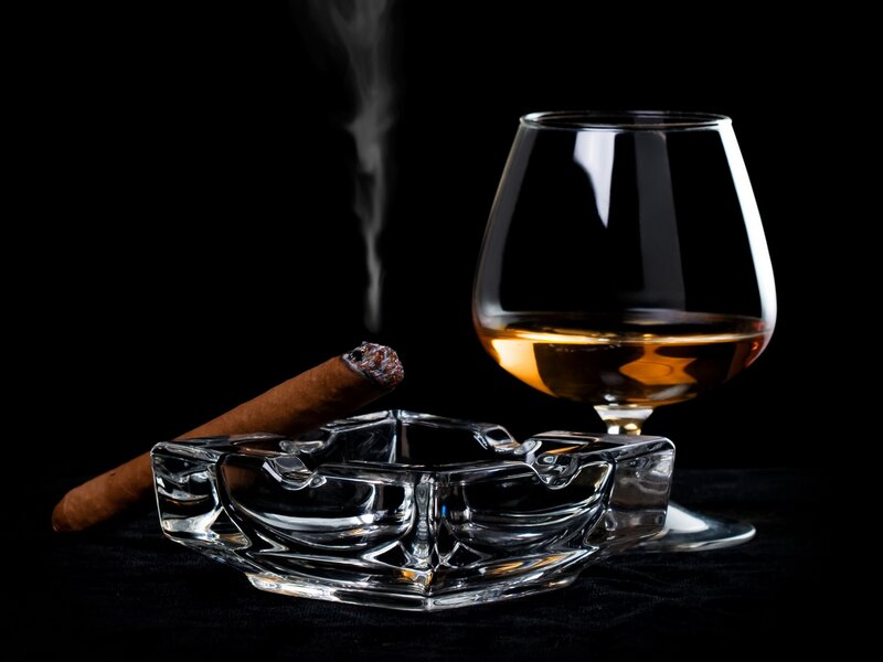 Cigar and brandy on black