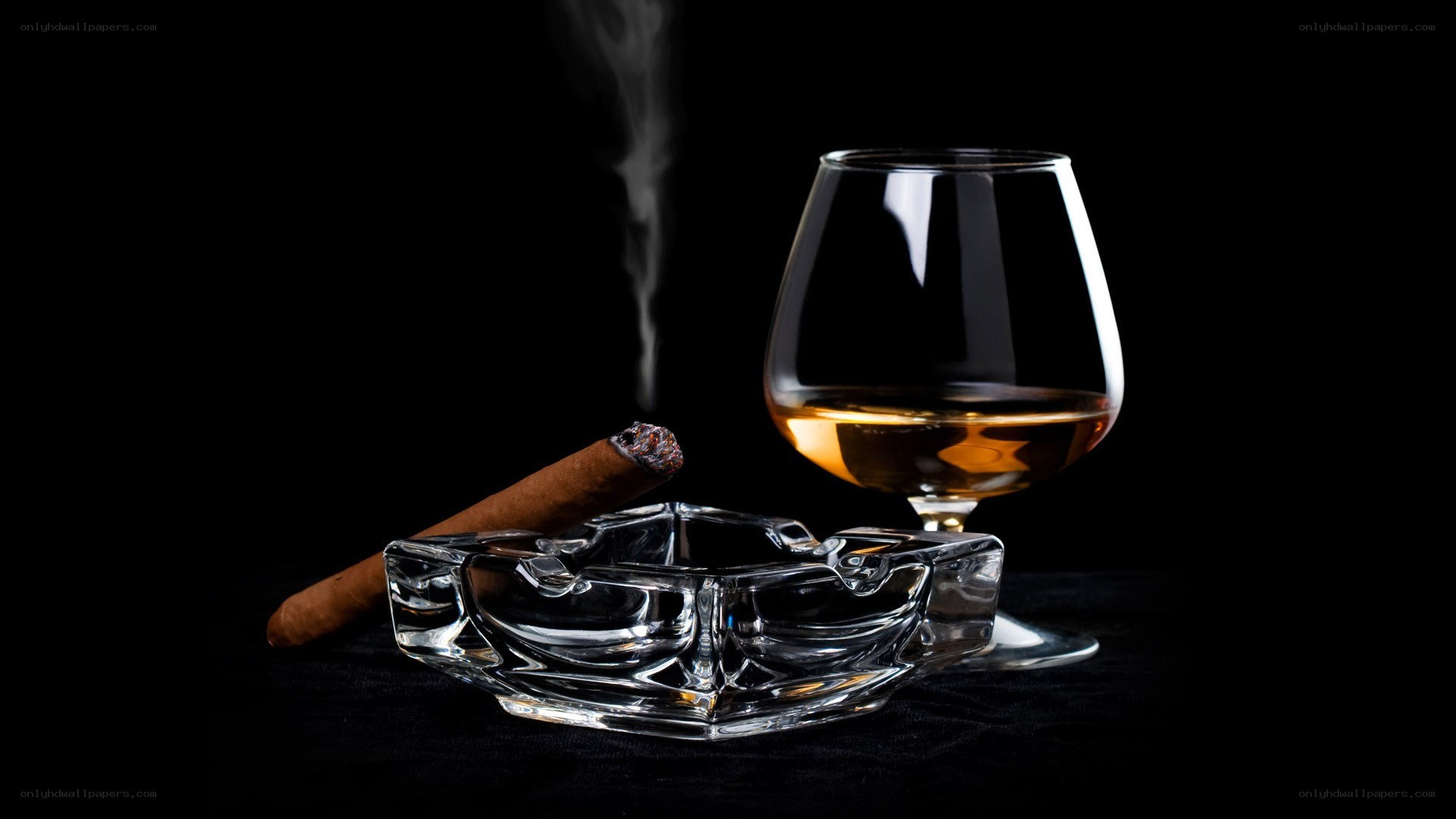 Cigar and brandy on black