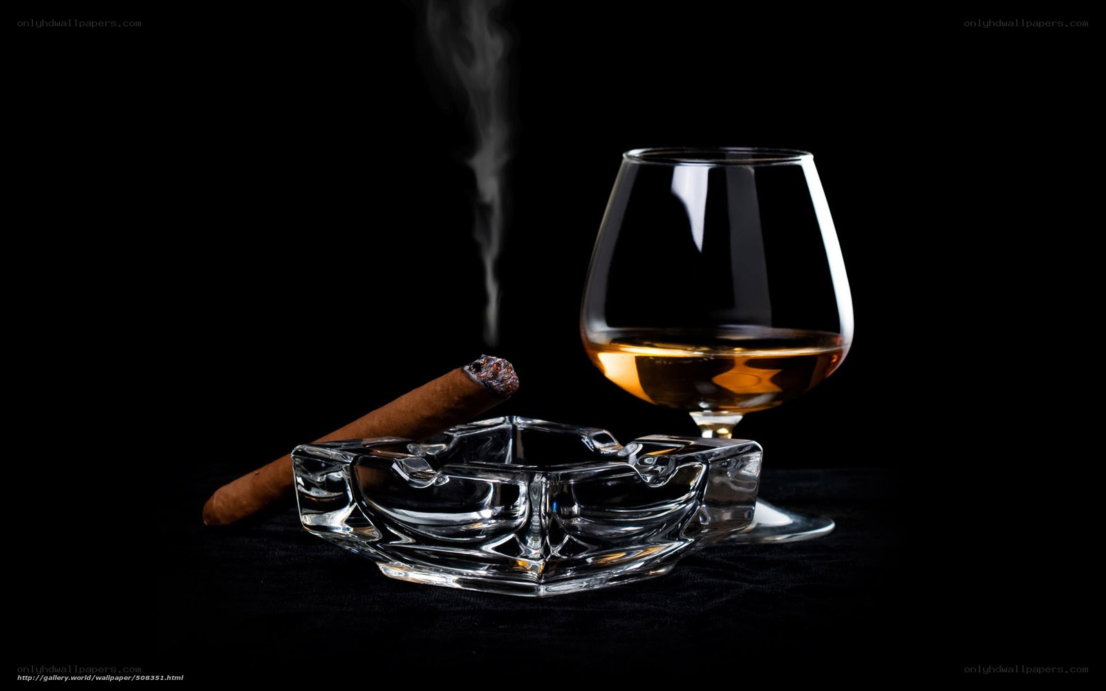 Cigar and brandy on black