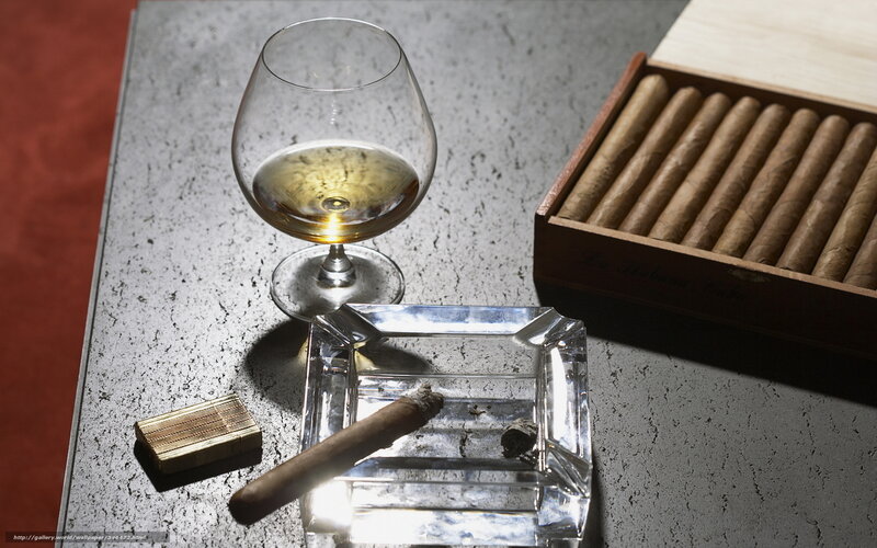 Cigar and brandy on table