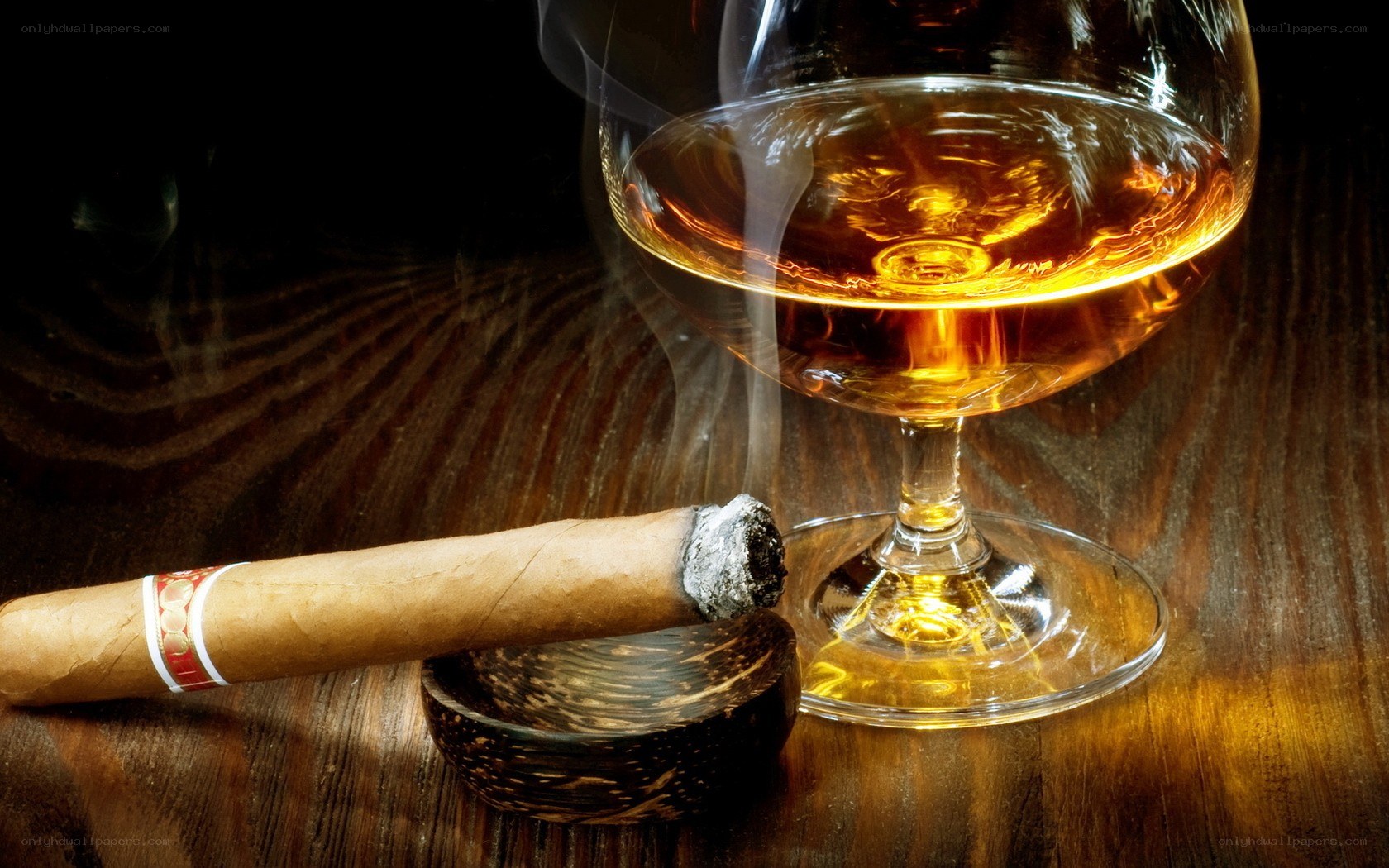 Cigar and brandy on wood