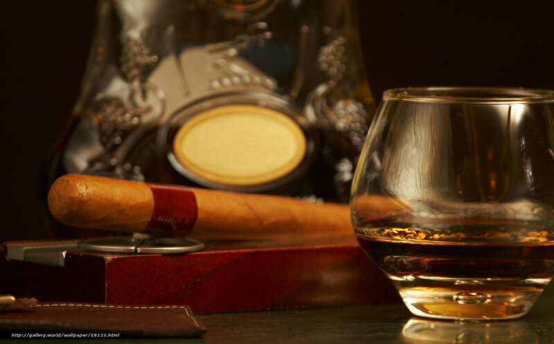 Cigar and whiskey on table