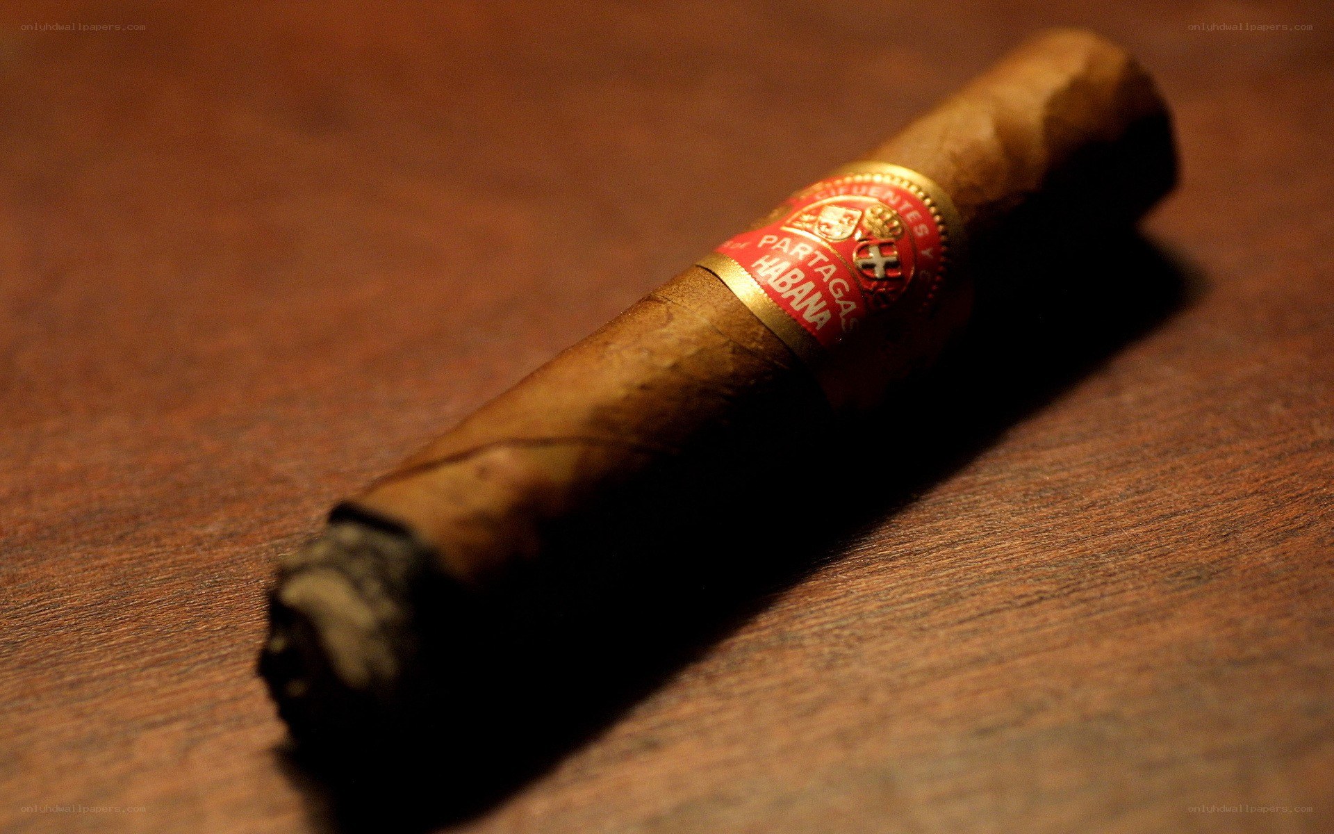 cigar on wooden surface