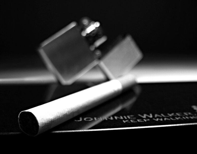 Cigarette and lighter on surface