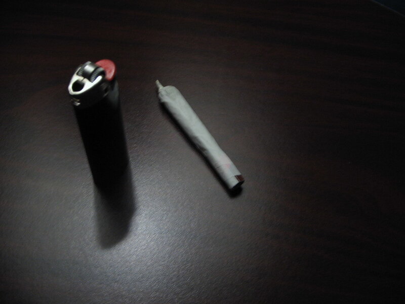 cigarette and lighter on table
